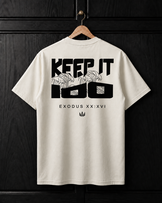 White t-shirt with black graphic design on a wooden hanger against a dark wooden background
